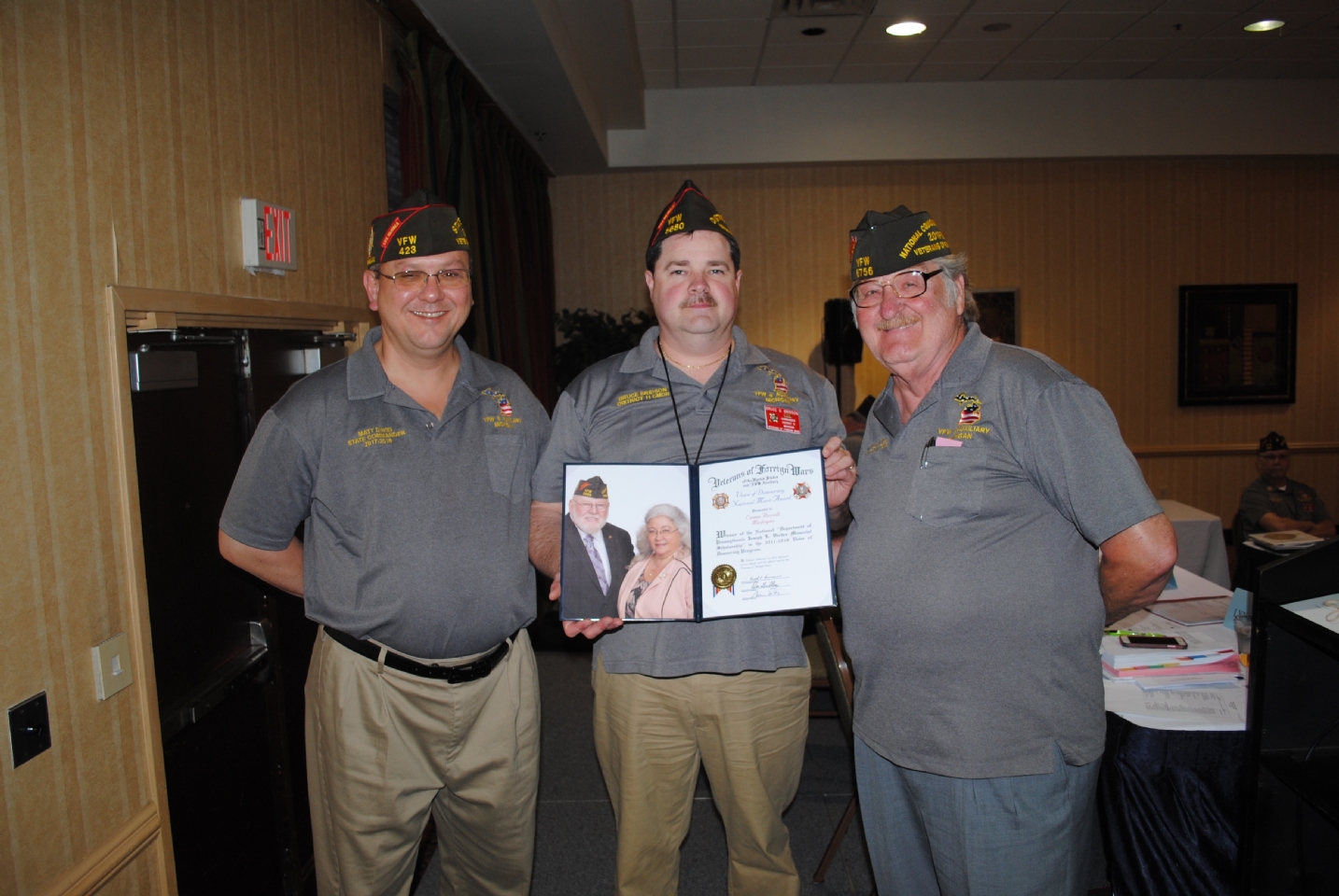 VFW Voice of Democracy National Merit Award presented to Emma Russell accepted by Bruce Birdson (c.) presented by Matt David (l.) and Harry “Les” Croyle (r.)